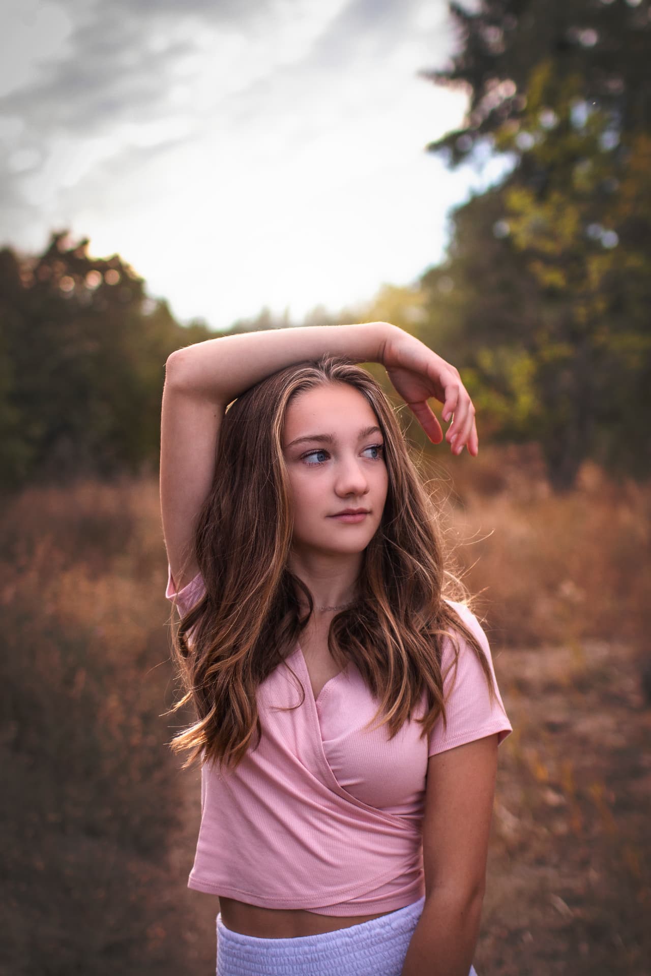 Senior portrait in soft pink at dusk